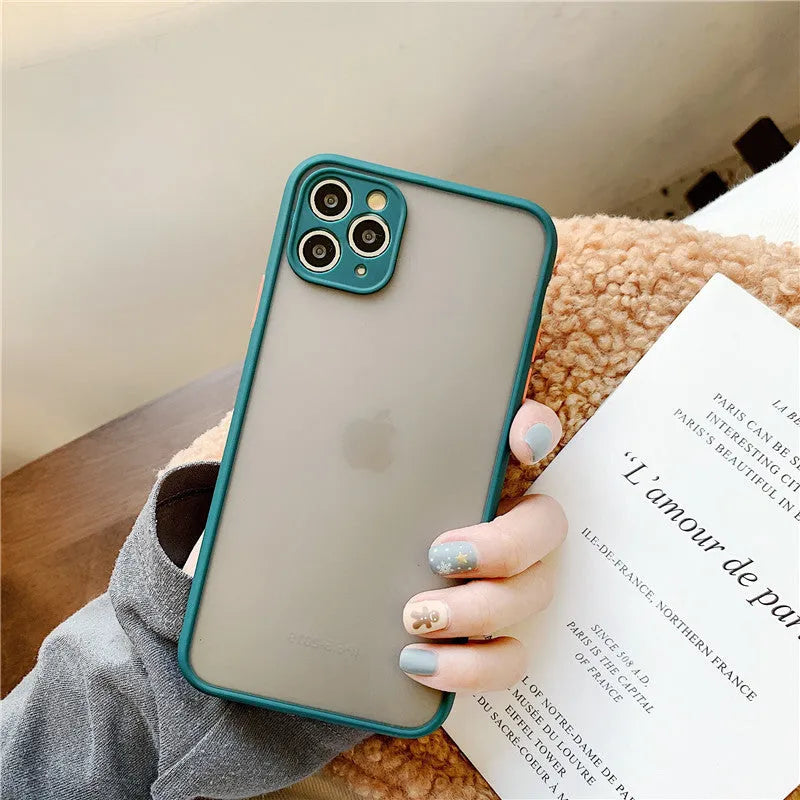 Solid colour silicone shockproof protective case for iPhone on a table.