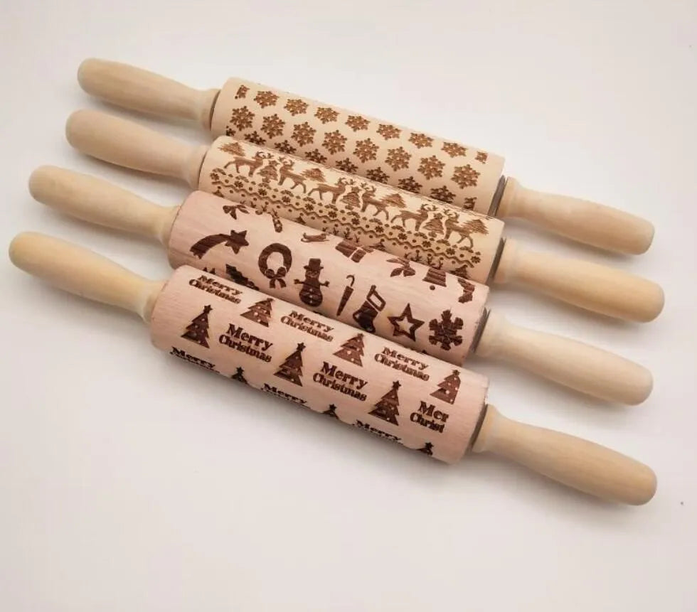 Solid wood rolling pin with embossed Christmas reindeer pattern on a 45cm long shaft.