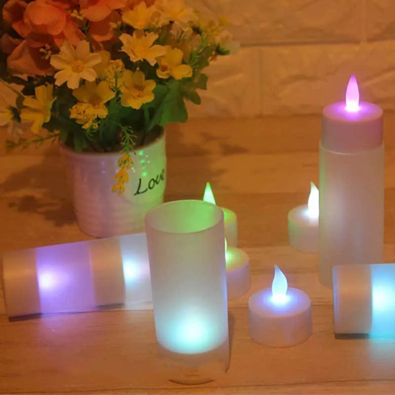 White plastic USB rechargeable LED candle lamp with flame-shaped head next to plastic cup and USB cable.