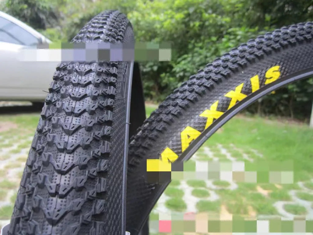 Mountain bike tyre showing tread pattern and sidewall with size markings