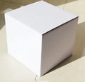 Square corrugated cardboard packaging box in black, shown next to size and colour options.