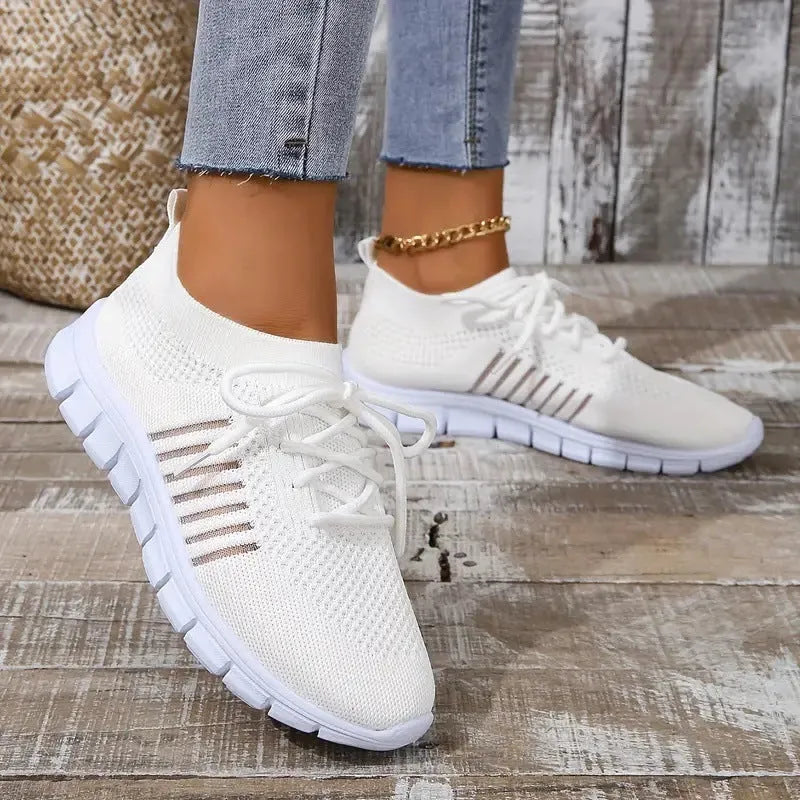Women's breathable flying knit flat shoes in mesh with EVA sole, shown in a neutral colour.