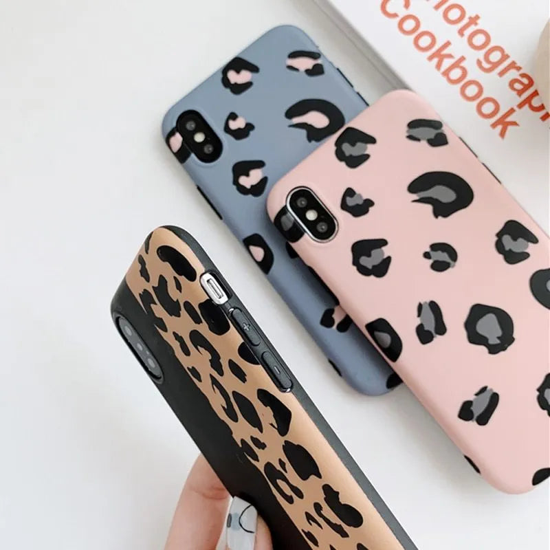 Leopard print pattern phone case for iPhone shown in black, blue, and pink colour options.