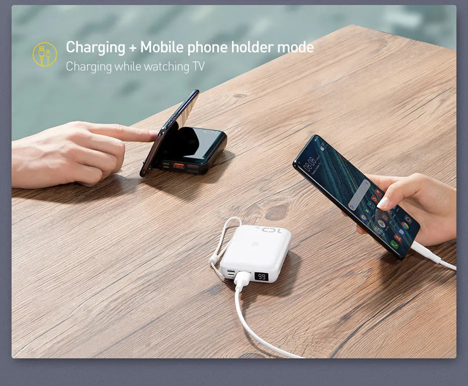 Small square black wireless fast charge power bank with LED digital display showing battery percentage