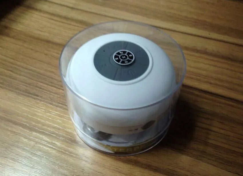 Mini waterproof Bluetooth speaker in blue, 98x88x43mm, with USB cable and button controls.