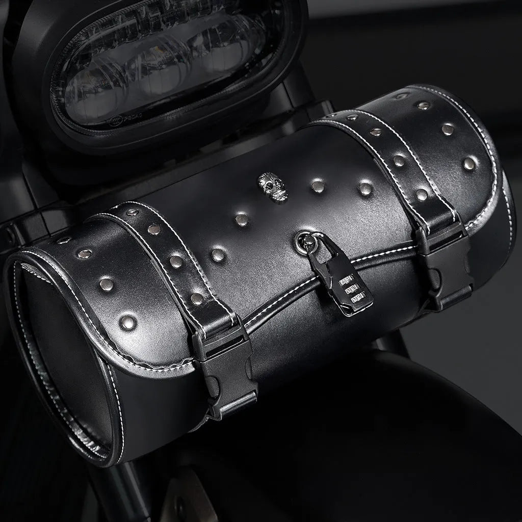 Black PU motorcycle pannier bag with punk retro styling mounted on a custom bike.
