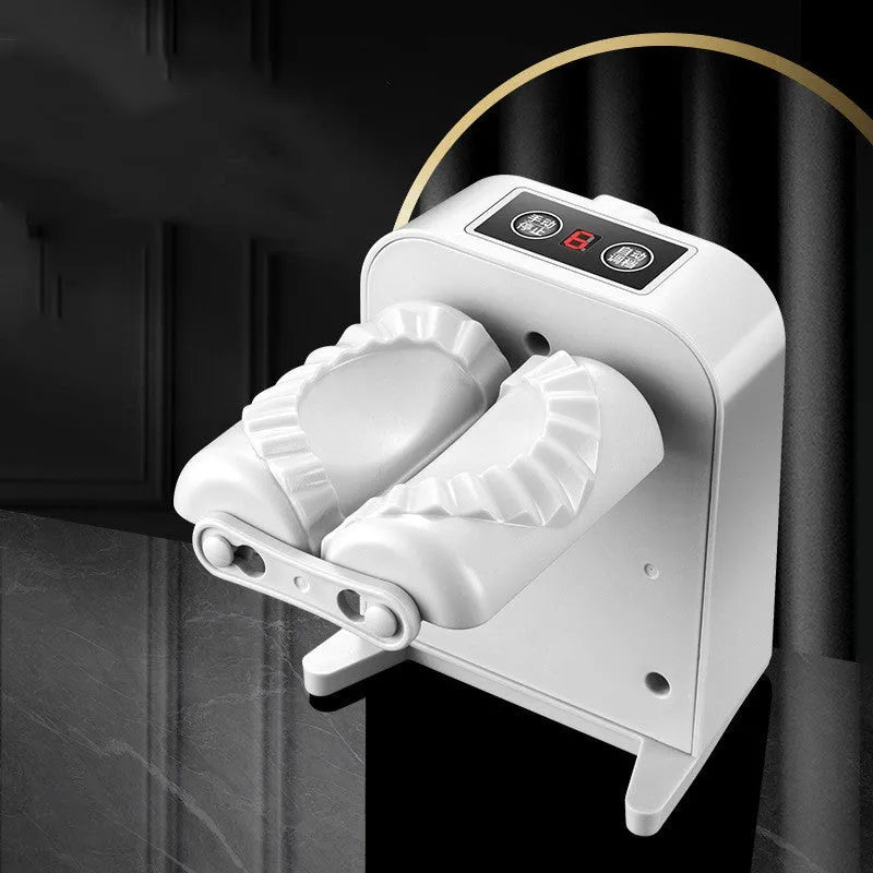 White electric dumpling maker machine with USB charging cable, brush, and spoon.