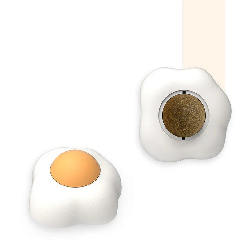 Catnip ball toy with 360-degree rotation mounted on wall, natural catnip filling visible through plush material