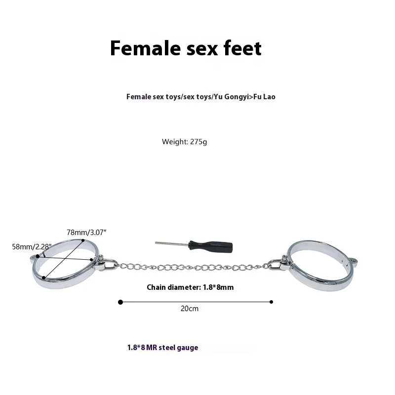 Silver zinc alloy handcuffs and footcuffs set with stainless steel chain linking on black background