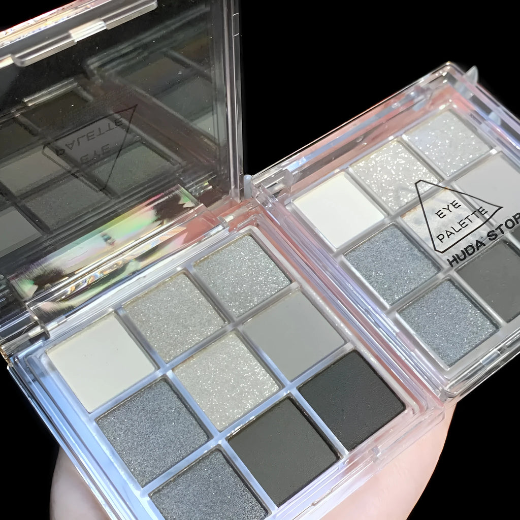 Smoked nine-colour eye shadow palette showing shades including white, silver, black, and iron grey.