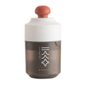 Green, pink and white manual plastic citrus juicer with 400ml capacity for portable use.