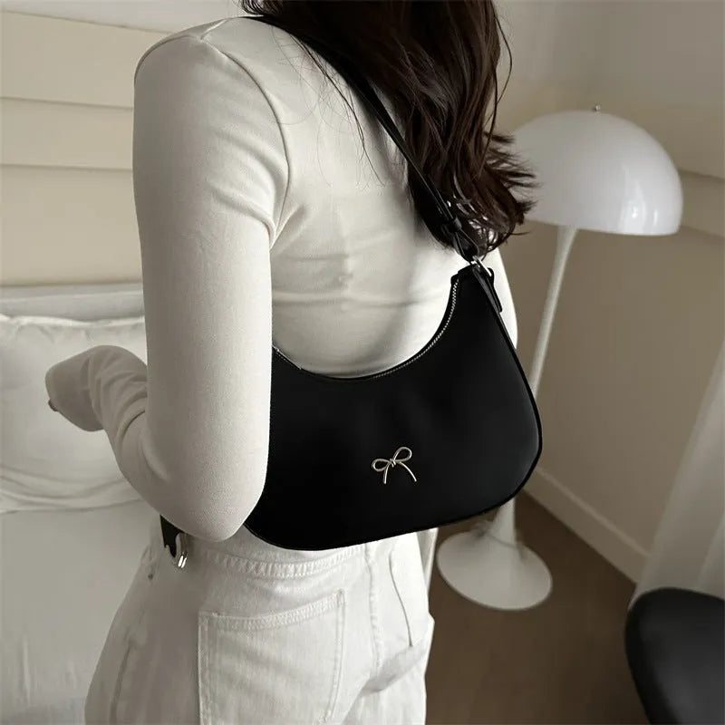 Women's PU dumpling-shaped underarm baguette handbag in six colours with a single strap.