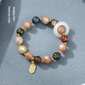 Hand-woven fragrant grey coloured glaze bracelet with round sunstone or white lip shell beads.