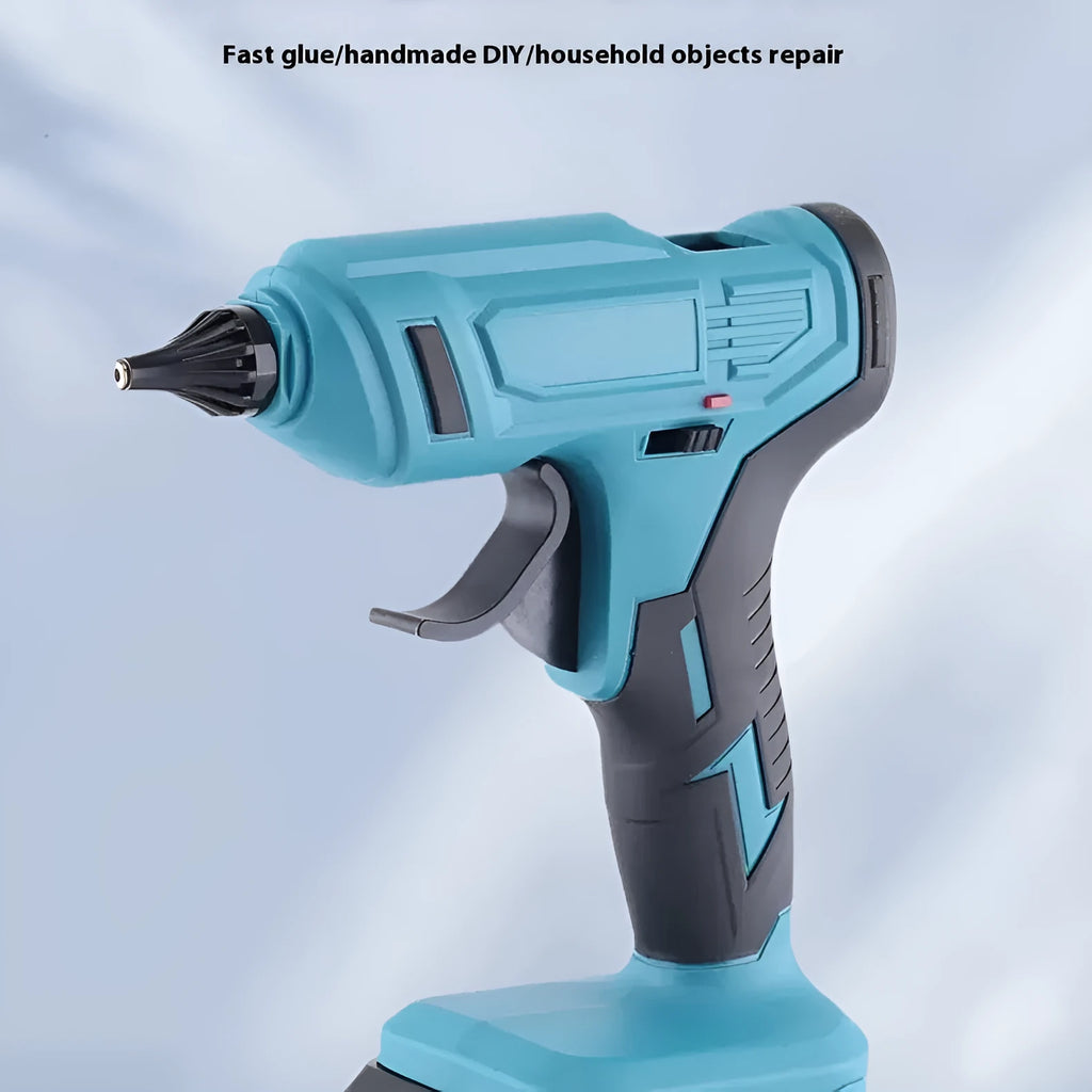 Cordless hot glue gun with two batteries, a charger, and a pack of glue sticks on a workbench.