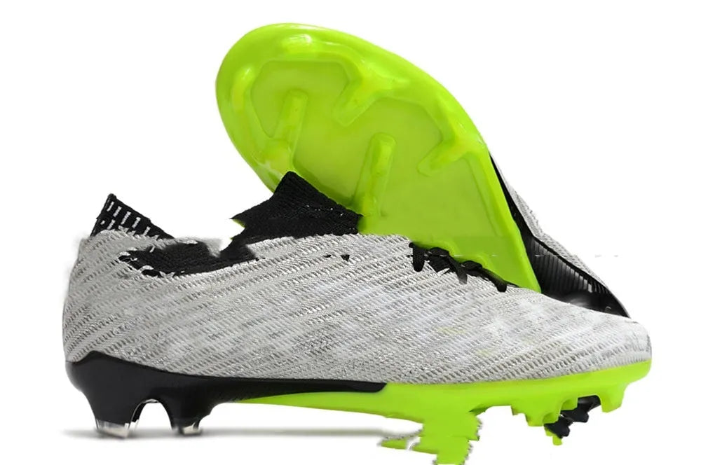 Men's low-top football boots with knitted upper, FG studs, and a lace-up front.