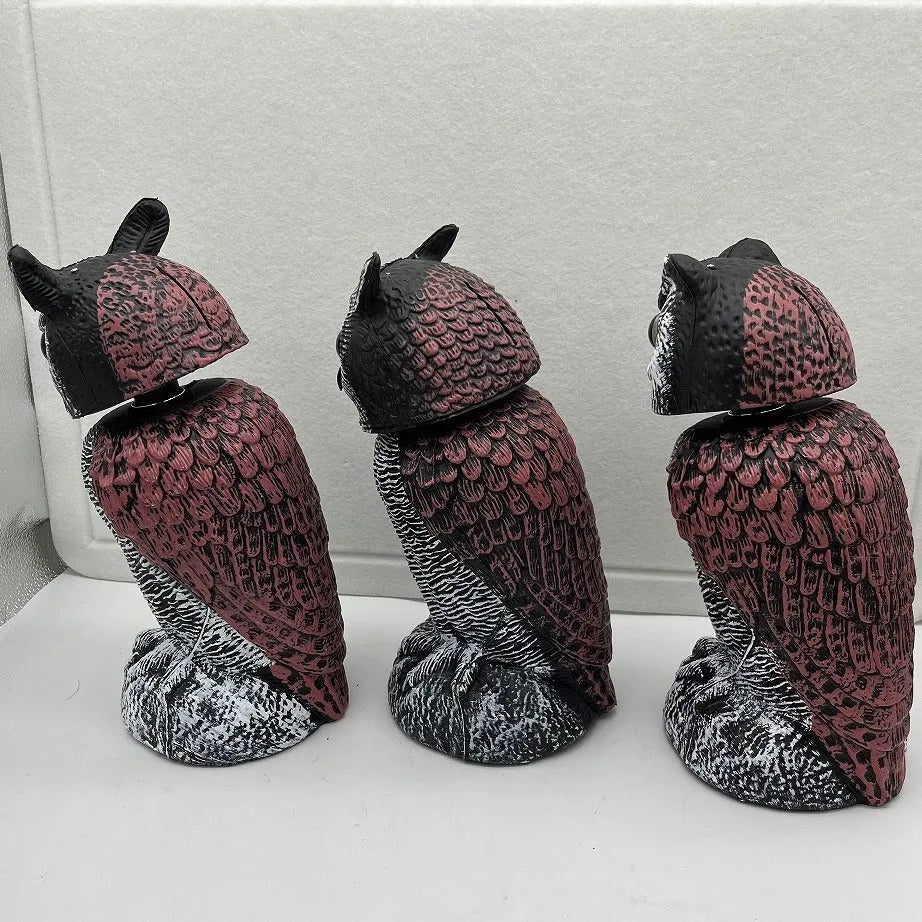 Artificial owl bait ornament with shaking head design for bird deterrent in garden setting