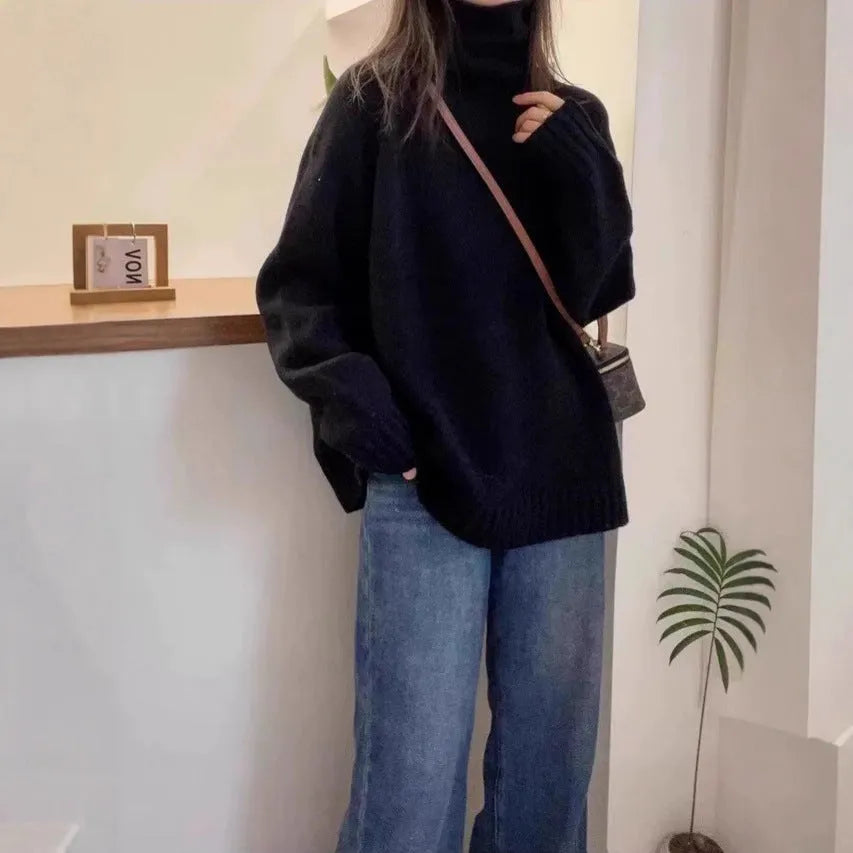 Women's loose-fit grey turtleneck sweater with thick curling pile collar, made of polyester mesh fabric.