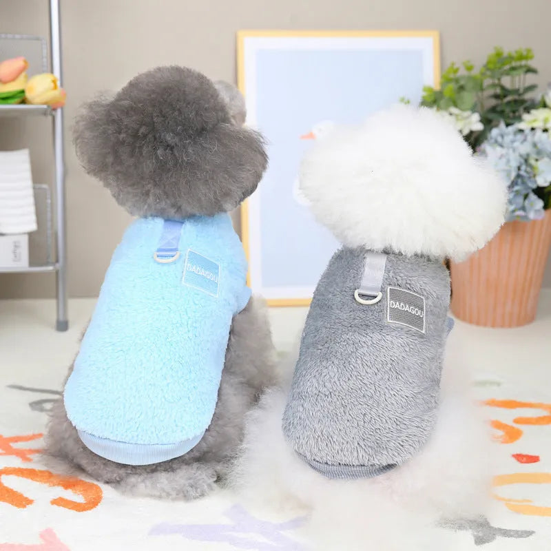 Blue coral fleece pet jacket for a dog, showing the coloured pull ring fastening.