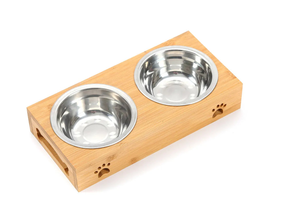 Solid wood pet dining table with stainless steel bowl inserts in a pine finish for dogs and cats.