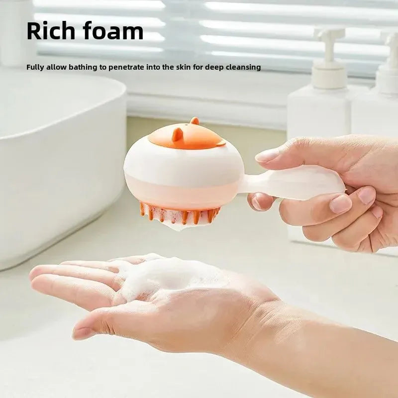 Blue automatic pet bath brush with soft gel head and hair removal comb on a white background.