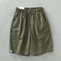 Men's loose straight linen shorts in black or green with drawstring waist