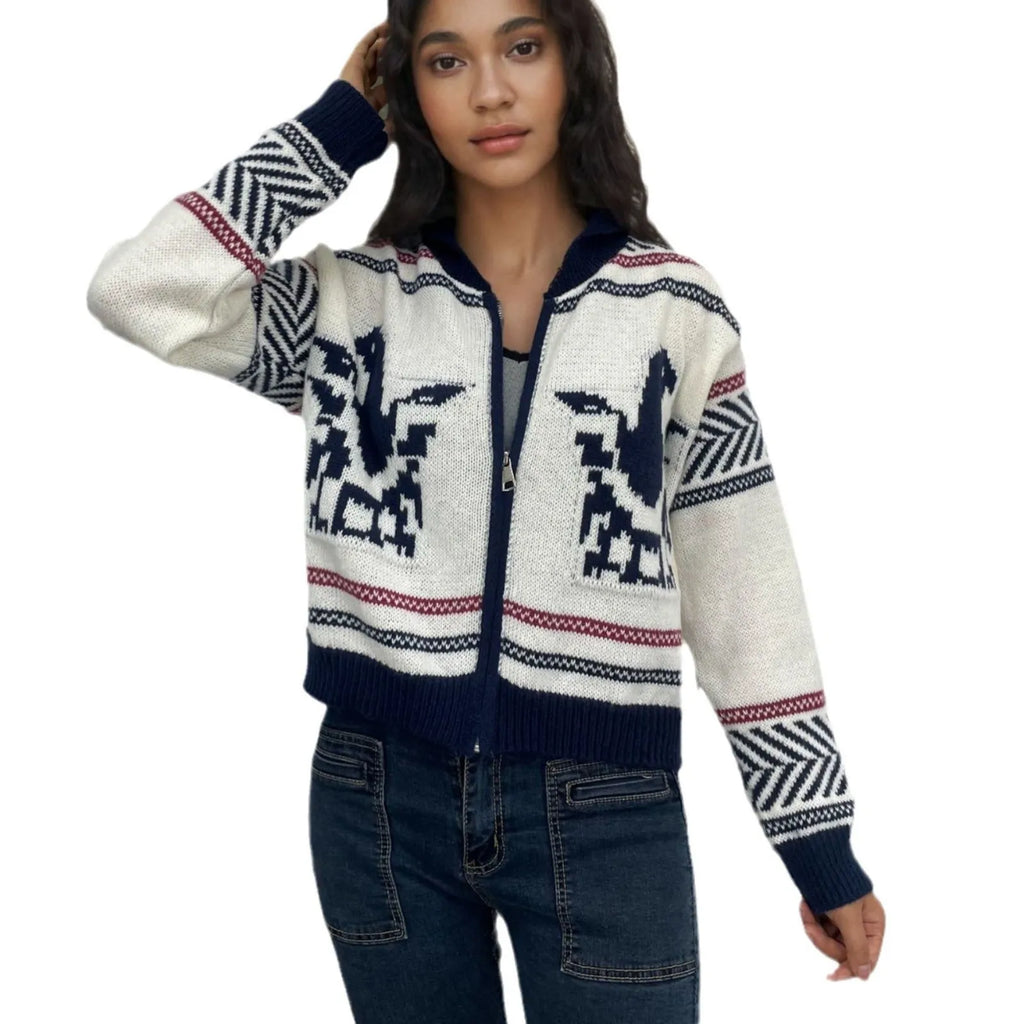 White women's zip cardigan with a contrasting striped jacquard lapel on a hanger.