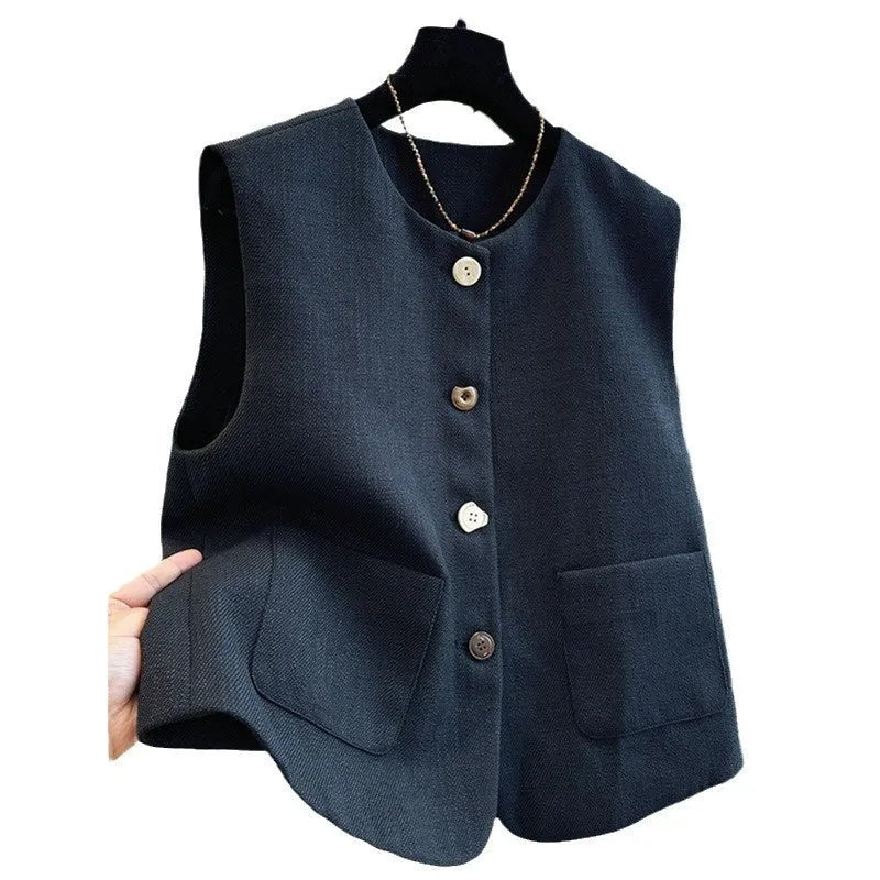 French style round neck sleeveless vest in milky white colour, showing bandage-style construction and polyester fabric texture