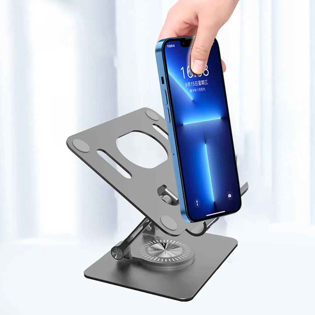 Rotating tablet stand with adjustable aluminium plate in silver colour on desk