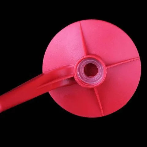 Red plastic Magic Tap soda dispenser for 2-litre bottles with push-in serving mechanism