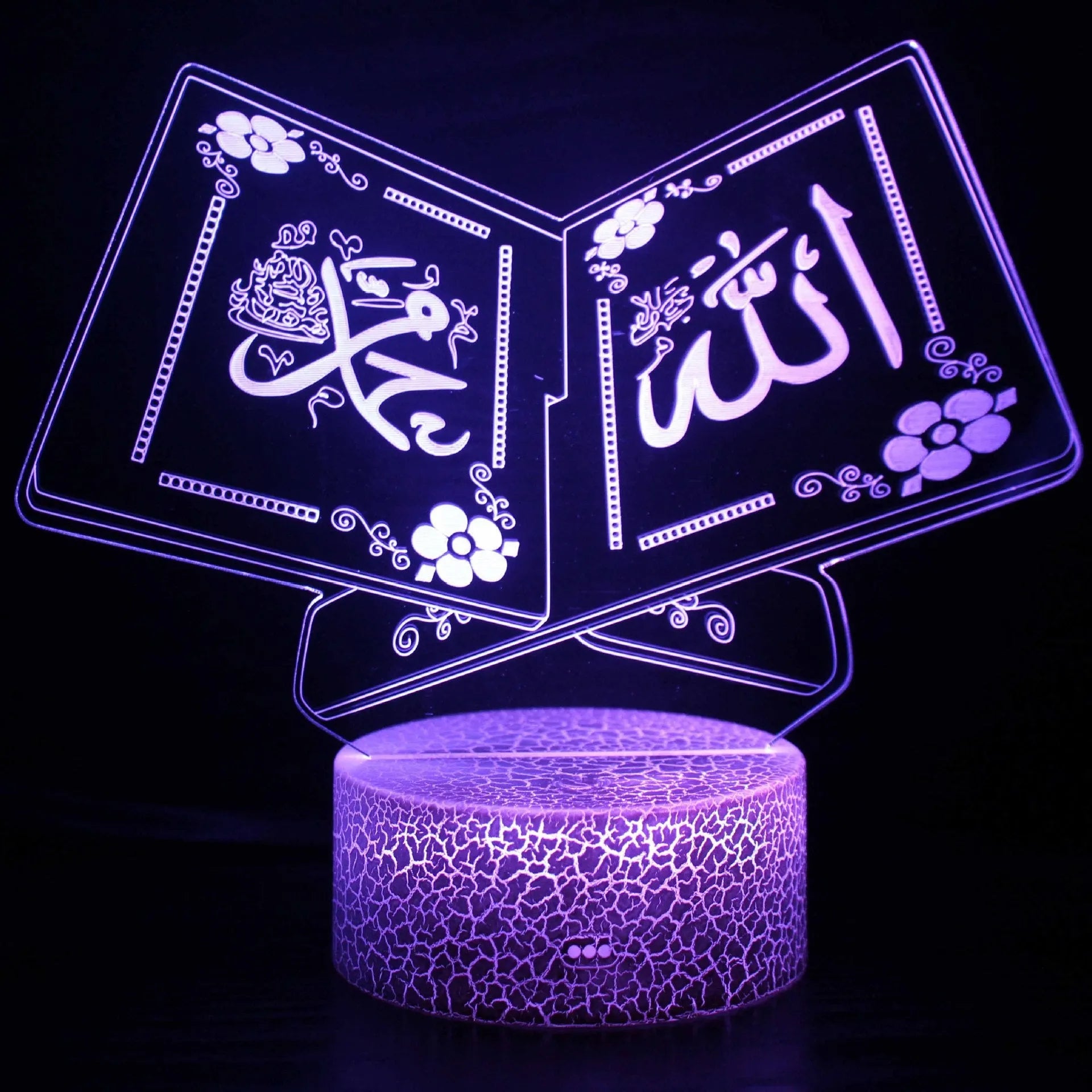 Cartoon-style 3D LED night light with black touch base and remote control on a bedside table.