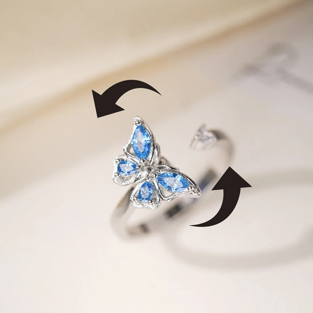 Adjustable butterfly ring in electroplated copper, available in white gold or yellow gold with blue or pink diamond finish