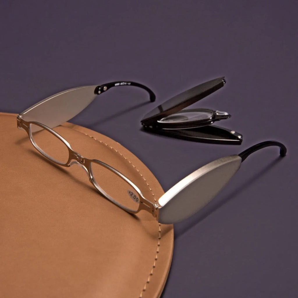 Folding pocket presbyopic glasses in retro style with ring elements, shown both open and folded to 12cm length
