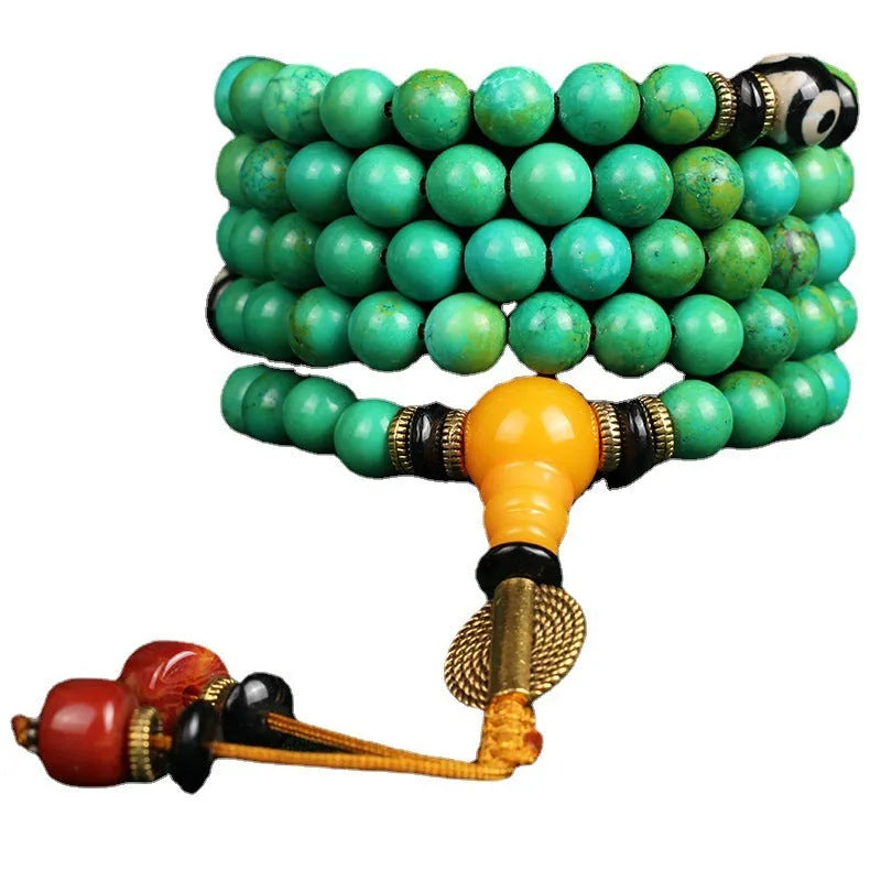 Natural turquoise gemstone bracelet with 108 round polished beads on a string.