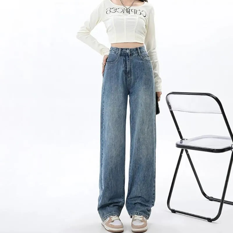 Women's retro blue wide-leg jeans with high waist and straight-leg cut on hanger