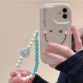 Mint green TPU iPhone case with decorative metal chain attached, shown next to standard version without chain.