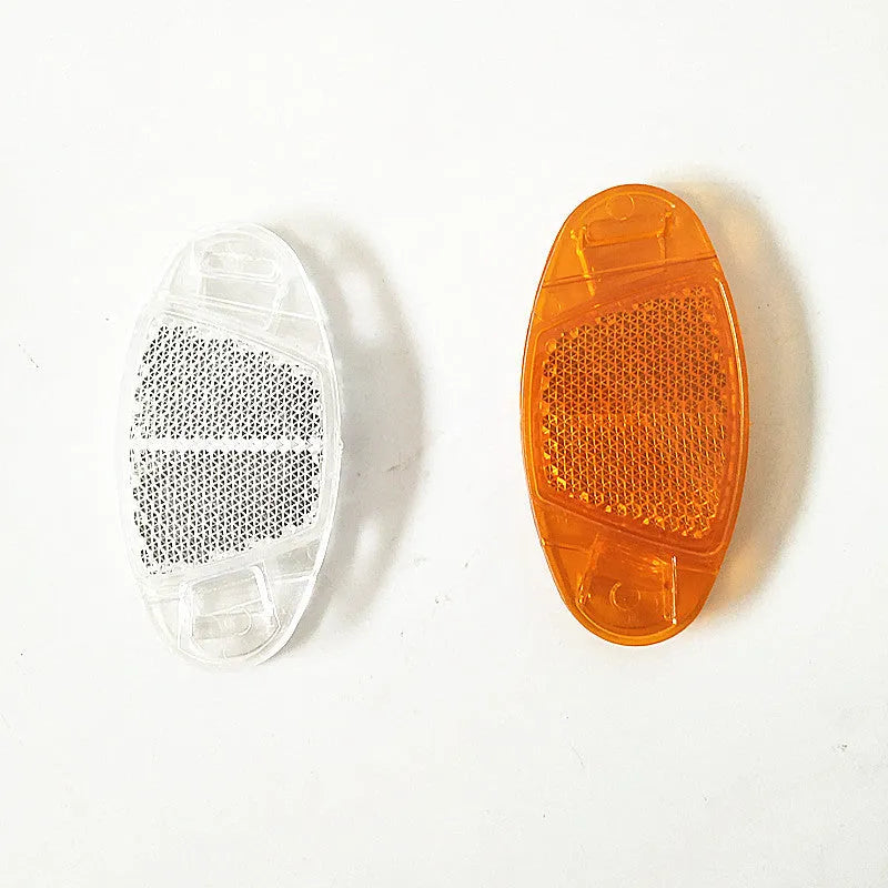 Bicycle reflector spoke decoration in white or yellow, measuring 7.2cm by 3.5cm for night-time cycling safety