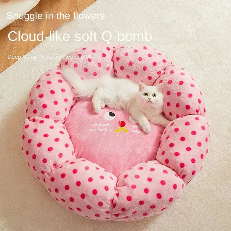 Pink dot pattern fabric cat bed shown in two circular sizes, 45cm and 65cm diameter.
