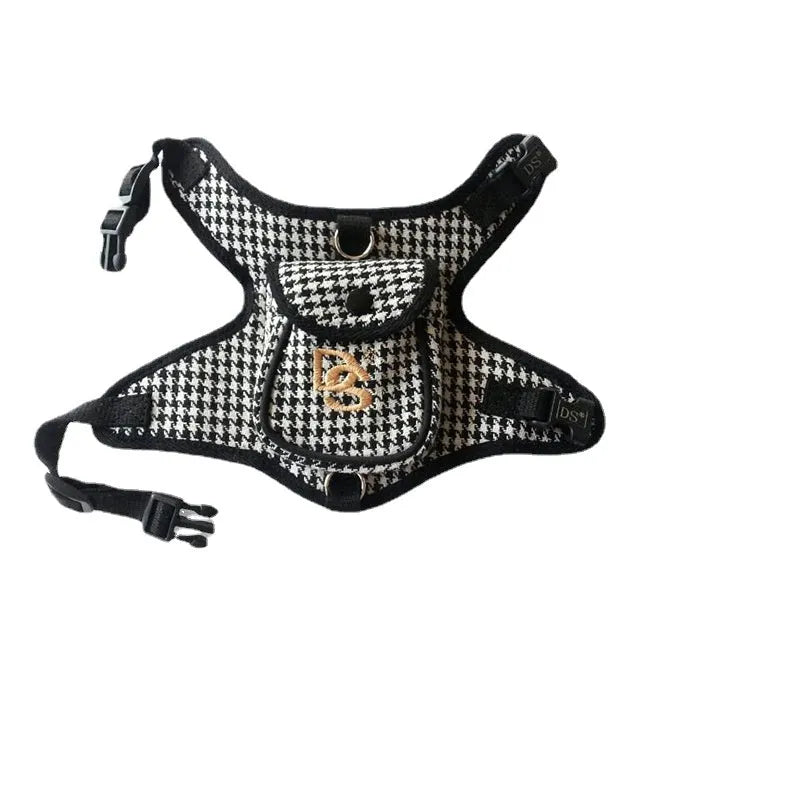 Black houndstooth cotton vest for a small dog, showing the leash attachment strap on the back.