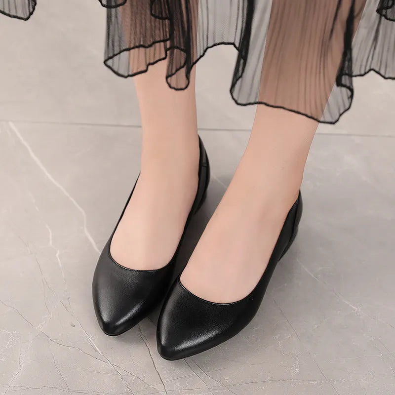 Beige pointed-toe casual shoes with a buckle fastening and flat rubber sole.