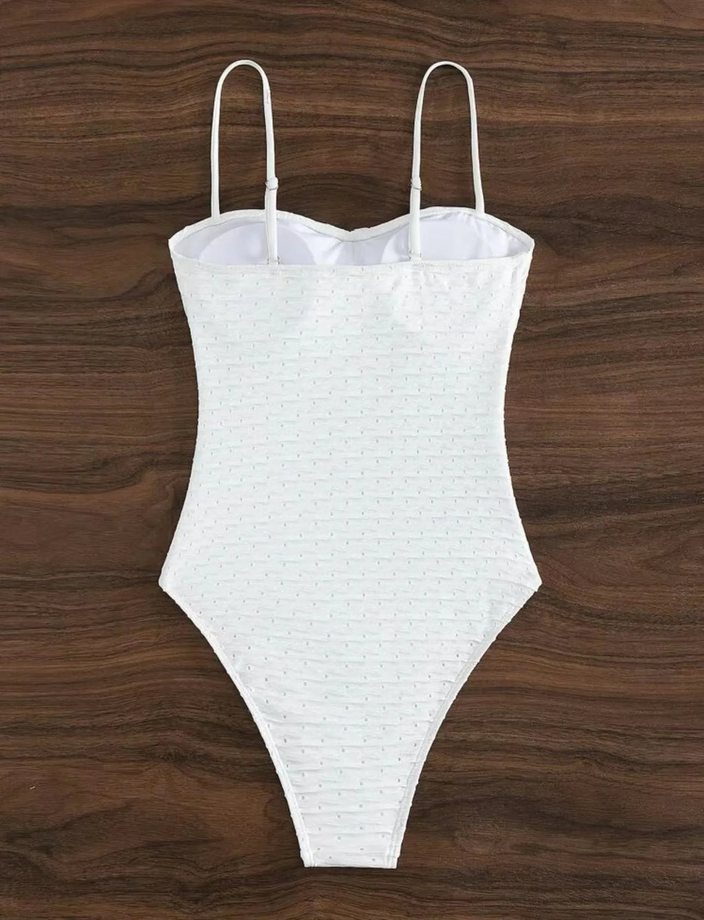 White women's one-piece swimsuit with sling style design
