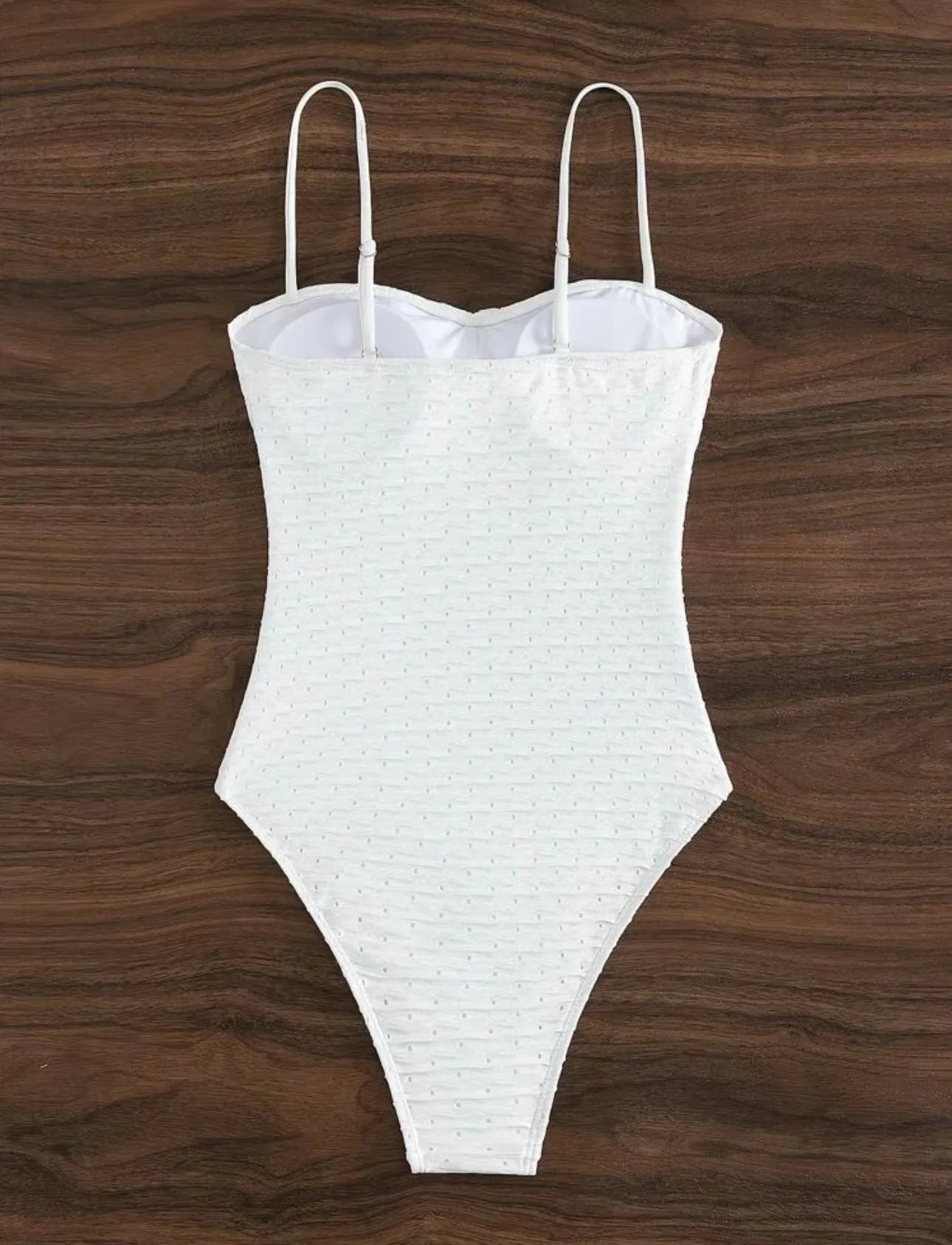 White women's one-piece swimsuit with sling style design