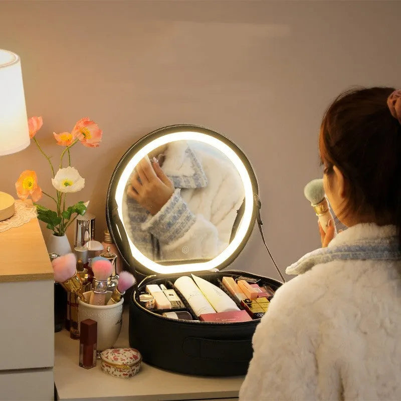 Round pink smart LED makeup bag with mirror lights open, showing internal partitions and adjustable lighting.