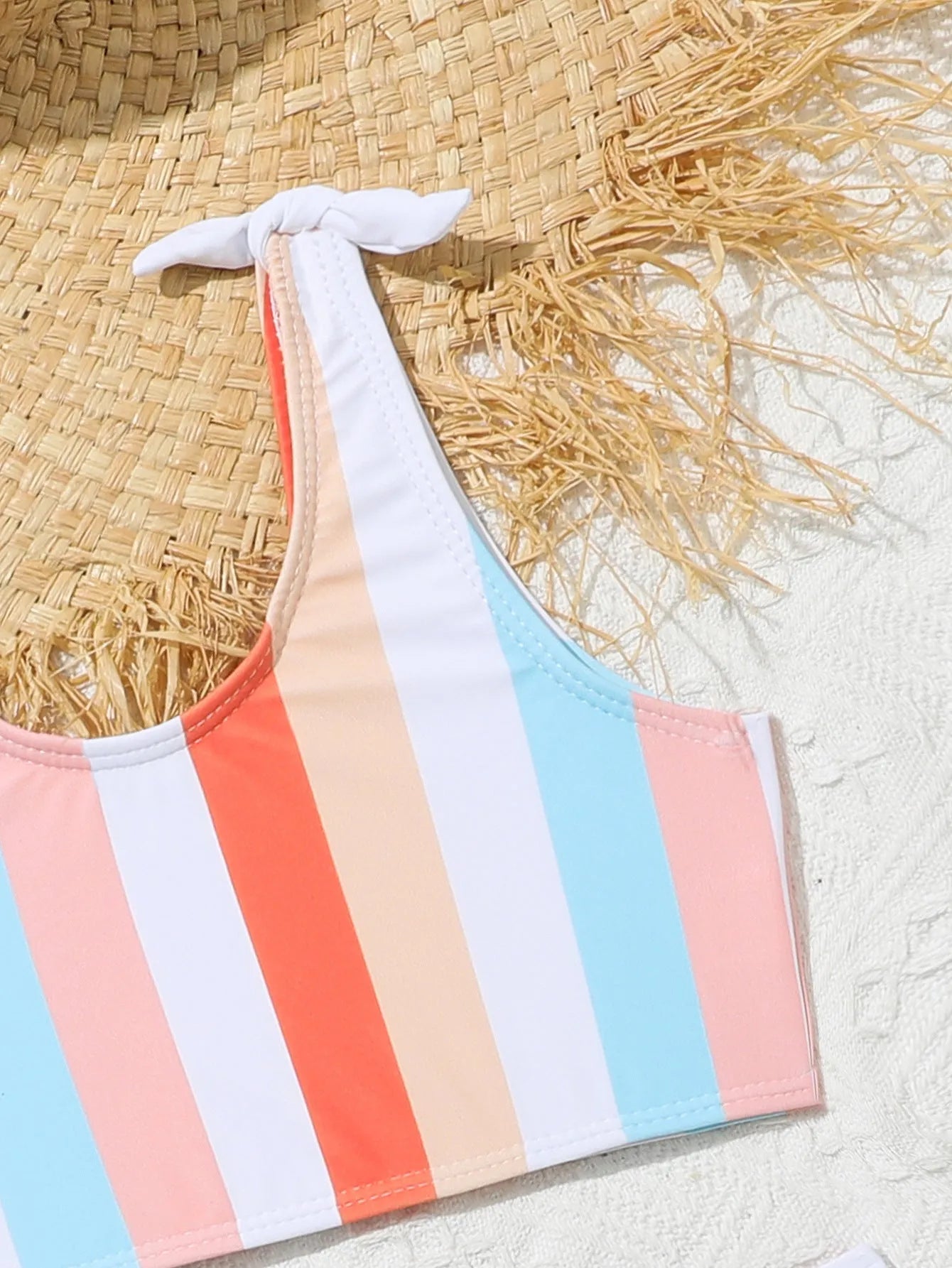 Girls plaid print swimsuit briefs with bra top, shown in multiple toddler and child sizes.