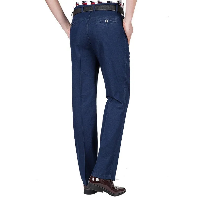 Men's high-waist loose blue denim trousers on a neutral background