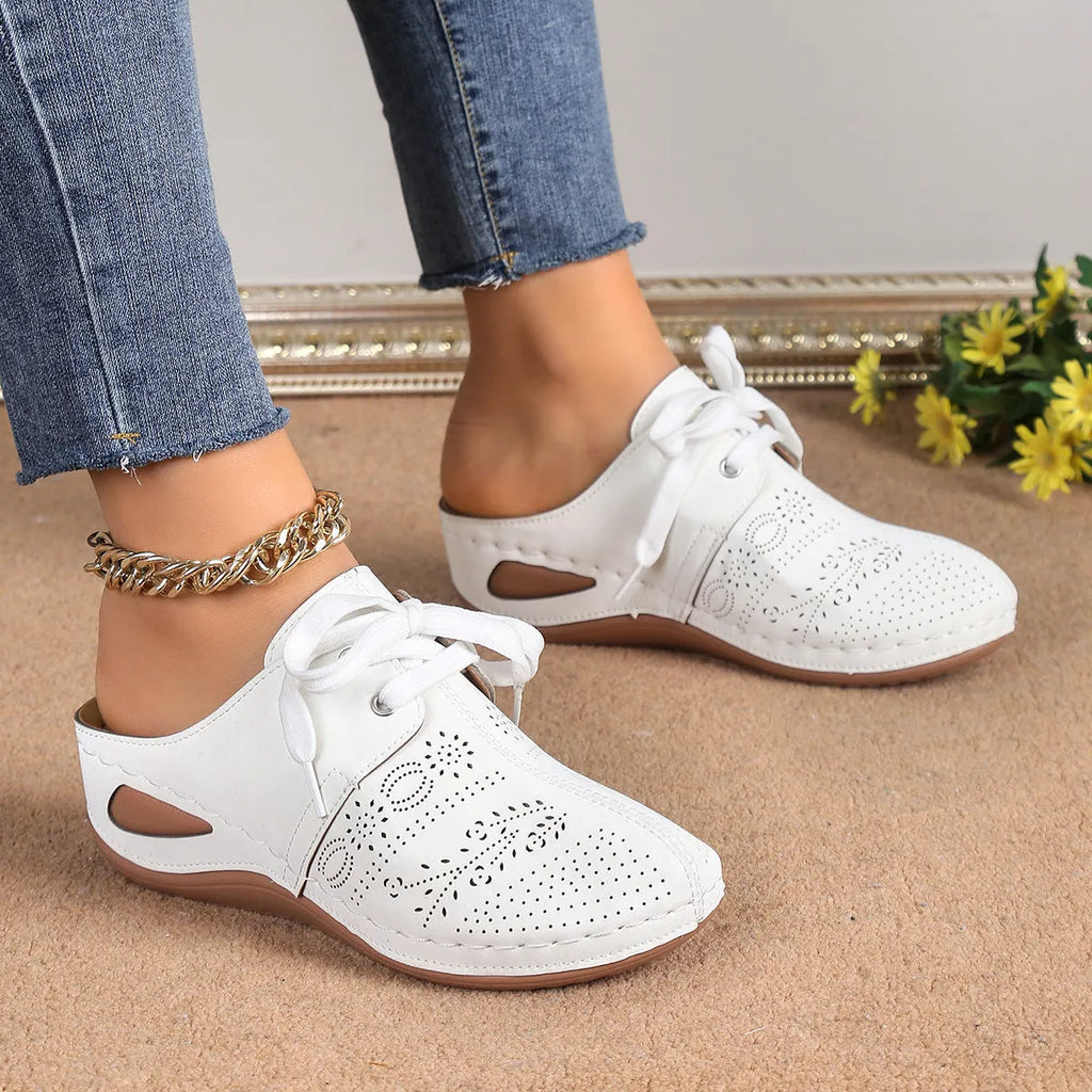 Women's Baotou lace-up slippers with hollow-out wedges in suede upper and rubber sole.