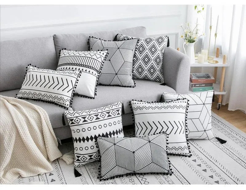 Bohemian National throw pillow in light grey colour with 30x50cm rectangular shape on living room sofa