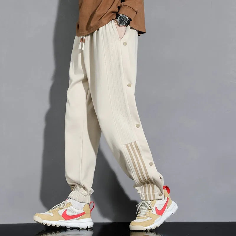 Men's ankle-tied sports pants in autumn colours with high waist and drawstring closure, sizes M to 6XL