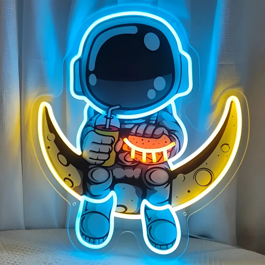Astronaut-shaped LED neon wall light with moon background, measuring 30 cm by 35 cm.