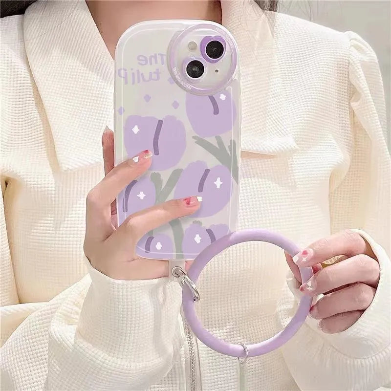 Purple tulip transparent iPhone case with heart-shaped camera detail and matching adjustable bracelet