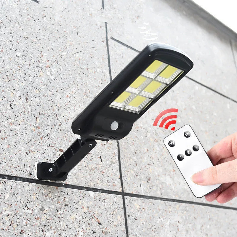 Black solar street light with motion sensor for outdoor gardens, showing PIR detection and solar panel